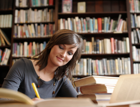 Young woman studying in library